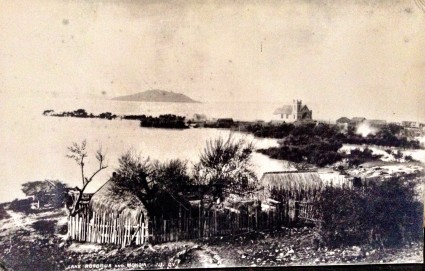 Ohinemutu, looking onto St. Faith's Church and Mokoia Island, late 1800's.